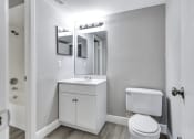 Thumbnail 14 of 33 - a bathroom with a toilet sink and mirror