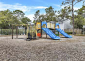 Thumbnail 24 of 33 - a playground with slides at a park