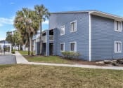 Thumbnail 33 of 33 - a blue building with palm trees in front of it