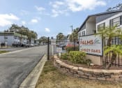 Thumbnail 28 of 29 - the sign for palms oaks at the entrance to a street with houses