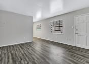 Thumbnail 3 of 29 - the living room of a new home with white walls and wood flooring