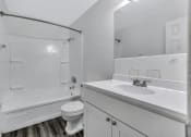 Thumbnail 12 of 29 - an empty bathroom with a sink toilet and shower