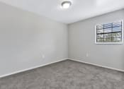 Thumbnail 11 of 29 - an empty room with carpet and a window