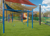 Thumbnail 22 of 29 - a playground with a swing set and a slide