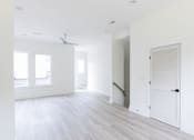 Thumbnail 8 of 26 - an empty room with a white door and white walls