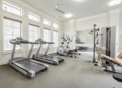 Thumbnail 27 of 41 - the gym with treadmills and other fitness equipment and windows