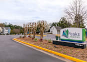 Thumbnail 1 of 31 - the sign for paws landing at the entrance to the parking lot of the office building