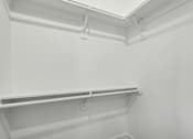 Thumbnail 21 of 38 - Empty white shelves in a room.