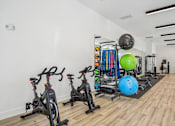 Thumbnail 28 of 39 - A gym with exercise equipment and a green exercise ball.