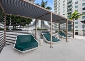 Thumbnail 24 of 66 - a patio with couches and a pergola