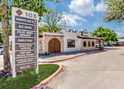 Thumbnail 46 of 62 - a sign in front of a taco restaurant with a parking lot