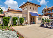 Thumbnail 42 of 62 - a golf cart parked in front of a hotel building