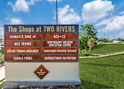 Thumbnail 41 of 62 - a sign for the shops at two rivers at the entrance of a park