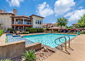 Thumbnail 20 of 62 - the preserve at ballantyne commons pool and spa with apartments in the background