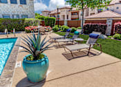 Thumbnail 25 of 62 - a patio with chairs and a swimming pool