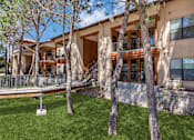 Thumbnail 43 of 62 - a large house with trees in front of it