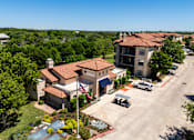 Thumbnail 9 of 62 - an aerial view of a building with cars parked in front of it