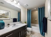 Thumbnail 36 of 48 - the preserve at ballantyne commons apartment bathroom with sink toilet and shower