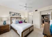 Thumbnail 42 of 48 - a bedroom with a large bed and a ceiling fan