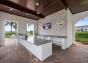 Thumbnail 43 of 48 - the pool bar is outfitted with a granite counter and a view of the house