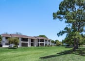 Thumbnail 12 of 27 - our apartments are located in a large grassy area with trees