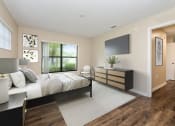 Thumbnail 46 of 46 - a bedroom with a large bed and a tv in a room