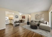 Thumbnail 20 of 46 - a living room with a couch and a table