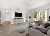 Thumbnail 18 of 33 - A living room with a grey couch, a white rug, and a white ceiling fan.