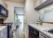 Thumbnail 14 of 29 - redesigned kitchen with granite countertops and stainless steel appliances at the preserve at great neck