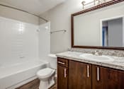 Thumbnail 21 of 29 - a bathroom with a sink toilet and bath tub
