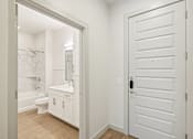 Thumbnail 45 of 57 - A white bathroom with a toilet, sink, and bathtub.