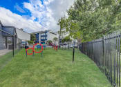 Thumbnail 20 of 26 - a fenced in dog park with agility courses and agility ropes