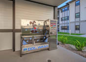 Thumbnail 20 of 23 - a dog wash vending machine outside of a building