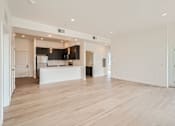 Thumbnail 6 of 22 - a kitchen and living room in a 555 waverly unit