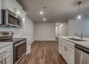 Thumbnail 8 of 19 - the heights on capitol hill apartments kitchen and living room