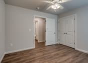 Thumbnail 14 of 19 - a bedroom with a ceiling fan