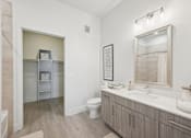 Thumbnail 14 of 26 - A bathroom with a toilet, sink, and medicine cabinet.