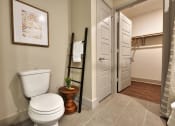 Thumbnail 5 of 17 - a bathroom with a toilet and a towel rack
