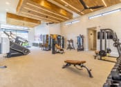 Thumbnail 28 of 33 - a spacious fitness center with treadmills and other exercise equipment