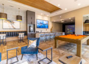 Thumbnail 26 of 33 - a games room with a pool table and bar
