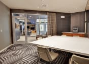 Thumbnail 16 of 17 - a meeting room with a large table and chairs