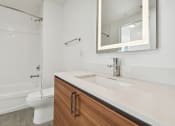 Thumbnail 64 of 66 - a bathroom with a sink toilet and shower