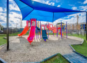 Thumbnail 35 of 36 - a playground with a swing set and slides