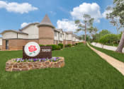 Thumbnail 3 of 16 - our apartments are located next to a sidewalk and green grass