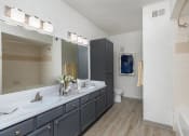 Thumbnail 7 of 23 - a large bathroom with a sink and a toilet