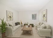 Thumbnail 6 of 28 - A living room with a couch, chairs, and a coffee table.