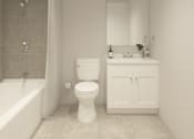 Thumbnail 8 of 19 - A white toilet and sink in a bathroom.