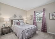 Thumbnail 8 of 23 - a bedroom with a bed and a window