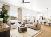 Thumbnail 17 of 30 - a living room with white walls and hardwood floors