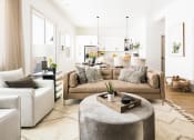 Thumbnail 1 of 30 - a living room with a couch and a table